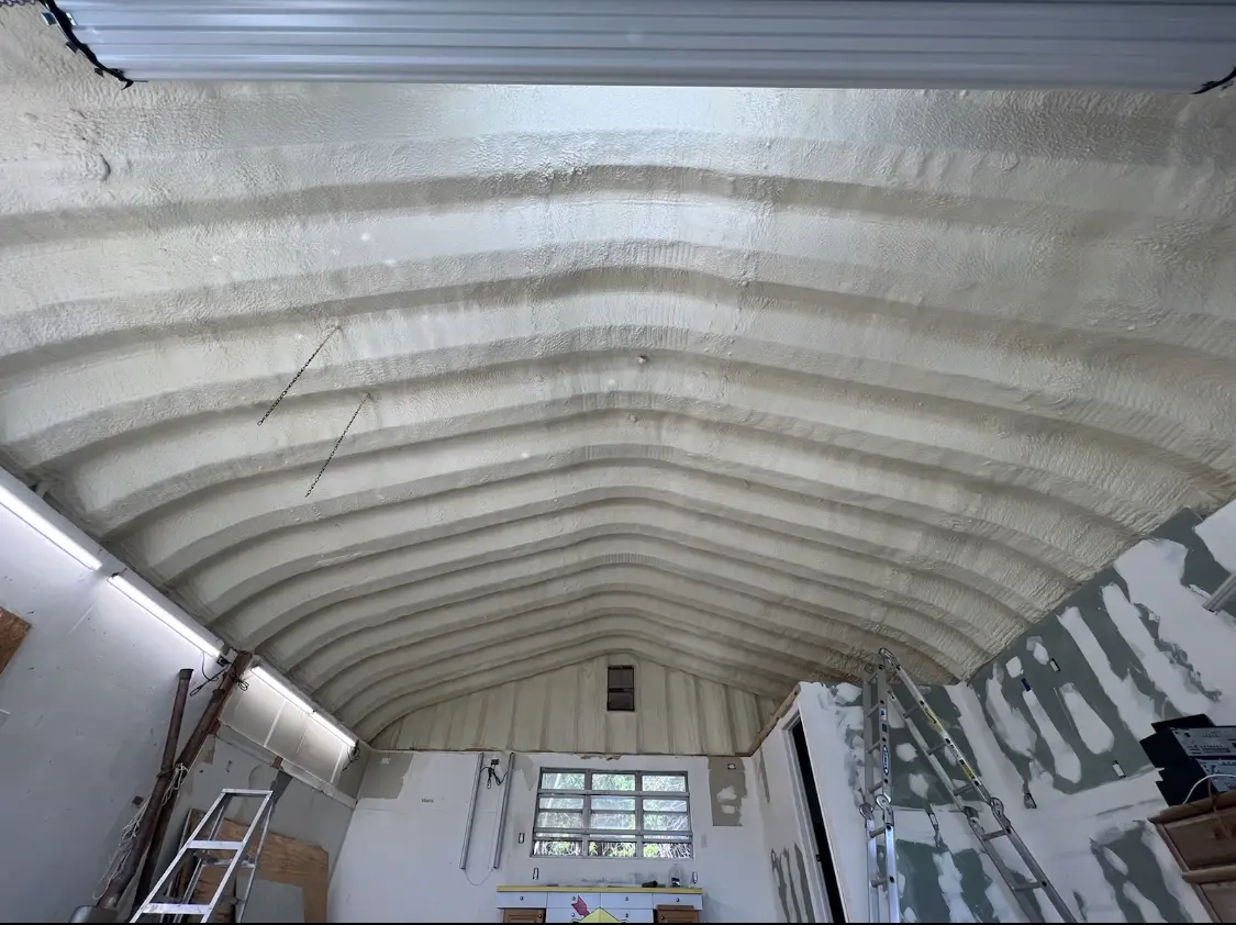 Spray polyurethane foam applied to the underside of a metal roof deck in Briar